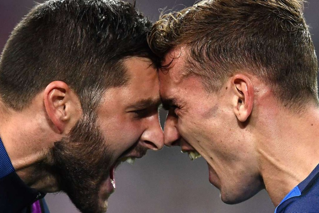 France Andre-Pierre Gignac celebrates with Antoine Griezmann after Griezmann’s second goal . Photo: AFP