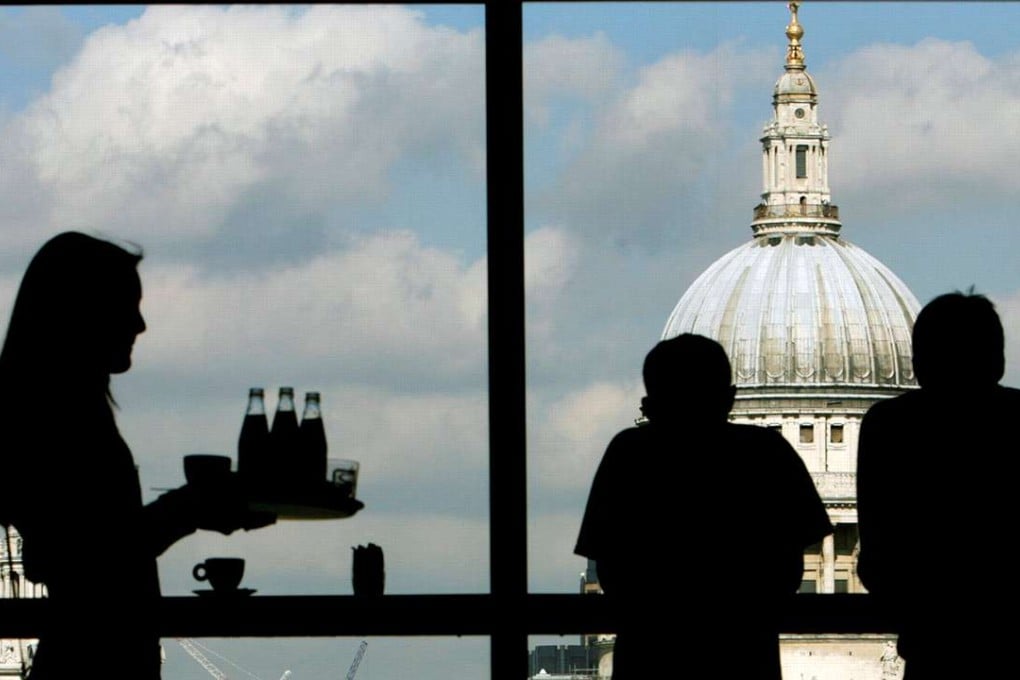 Visitors admire St Paul's Cathedral from the restaurant floor of the Tate Modern gallery in London. Unravelling a 43-year-old relationship is complicated. Photo: Reuters
