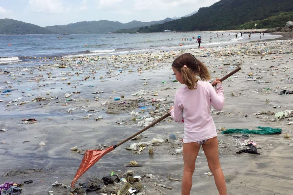 A girl takes part in a clean-up at Cheung Sha beach on Lantau. Photo: SCMP Pictures