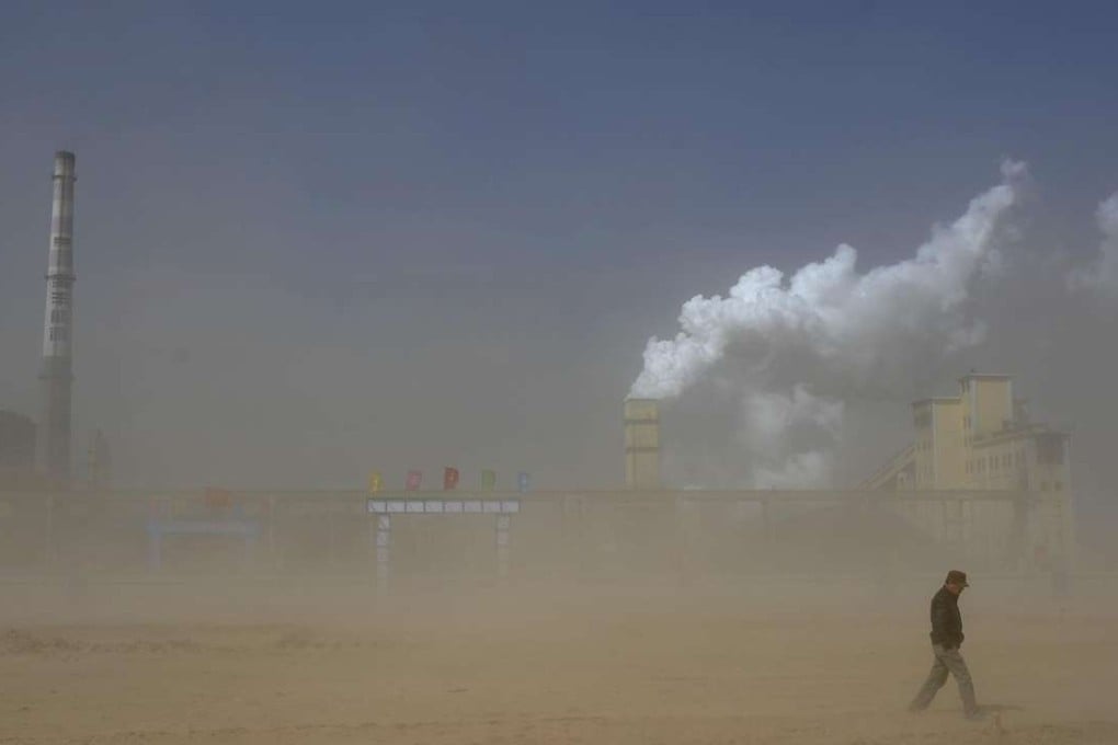 A man walks past a coal plant in Lingwu, in Ningxia Hui Autonomous Region, which is one area where environmental inspectors are being sent. Photo: Reuters