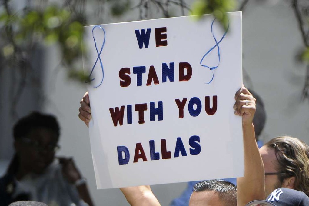 People attend an interfaith prayer event for the victims of the mass shooting that killed five police officers and wounded seven others, during a protest over recent police shootings in Minnesota and Louisiana, in Dallas, on July 8, 2016. Photo: TNS