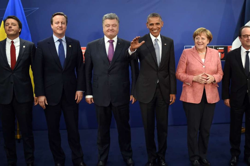 From left: Italy's Prime Minister Matteo Renzi, Britain’s Prime Minister David Cameron, Ukraine’s President Petro Poroshenko, US President Barack Obama, Germany’s Chancellor Angela Merkel and France's President Francois Hollande pose for a photo after a ‘quint’ meeting during the Nato Summit in Poland. Photo: AFP