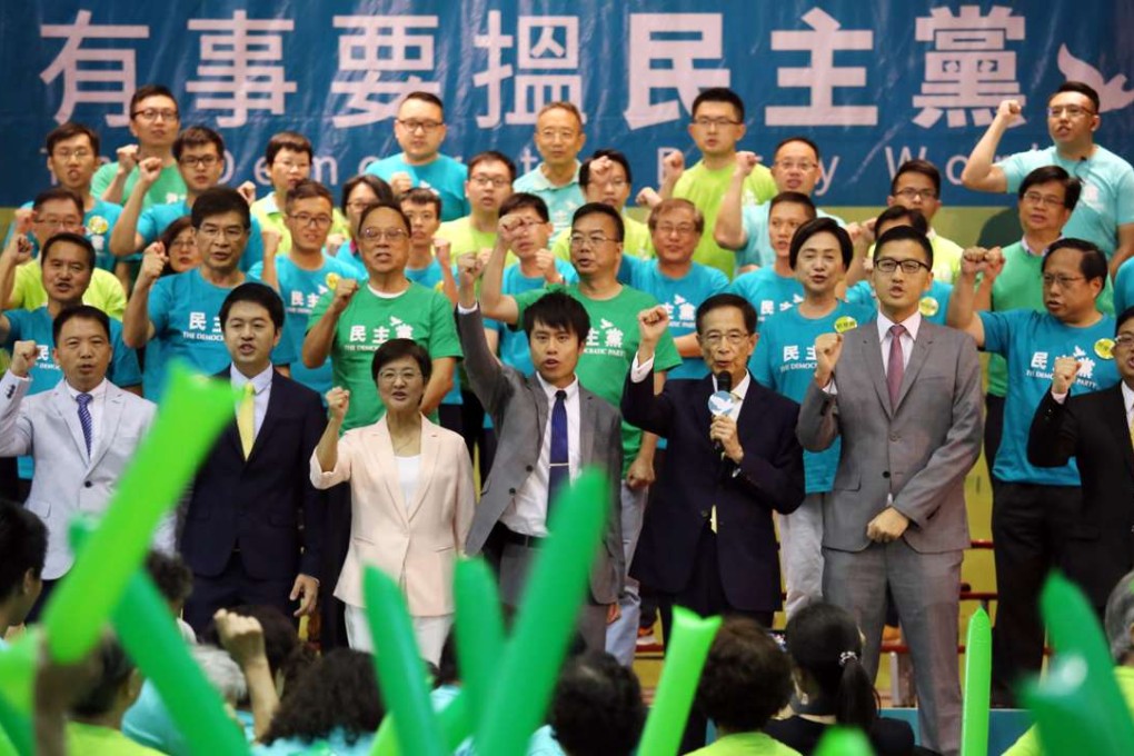 Democratic Party members rally at an election oath-taking ceremony ahead of the Legco polls in September. Photo: Nora Tam