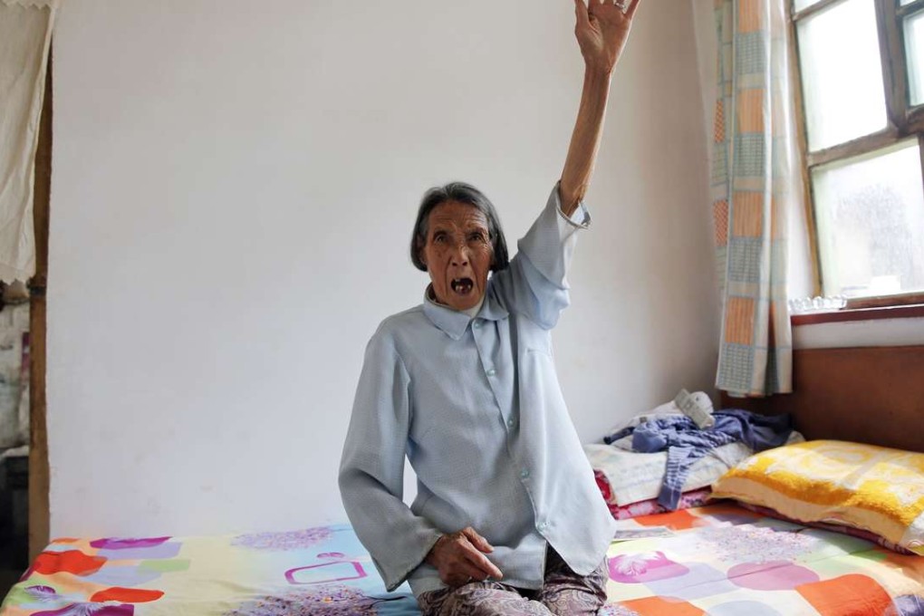 Former ‘comfort woman’ Ren Lane, who died on July 1, gestures as she speaks about her experience as a sex slave at her home in Shanxi province in July last year. Photo: Reuters