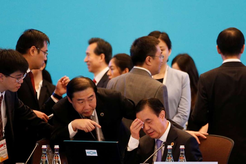 China's Commerce Minister Gao Hucheng wipes his brow before the opening ceremony of the 2016 G20 Trade Ministers Meeting in Shanghai. Photo: Reuters