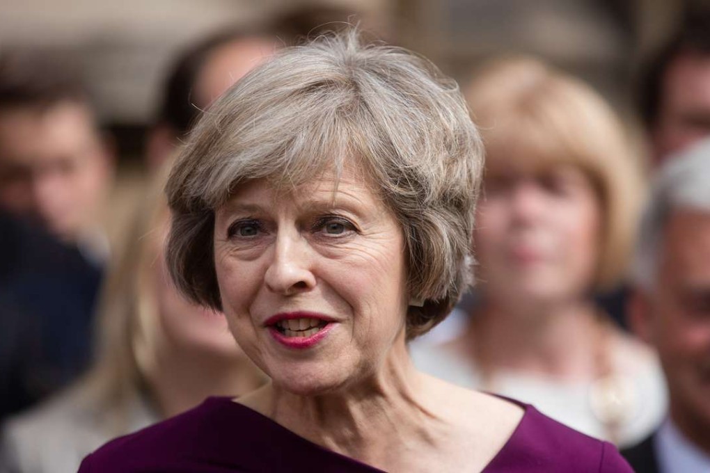 Theresa May speaks to members of the media. Photo: Bloomberg