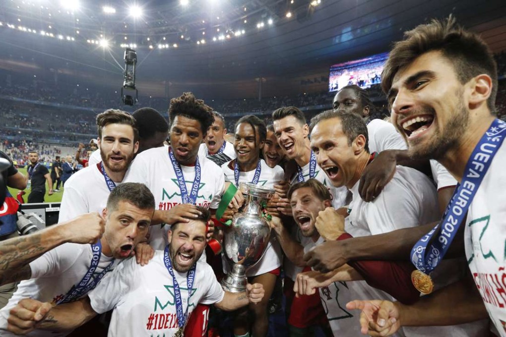 Football Soccer - Portugal v France - EURO 2016 - Final - Stade de France, Saint-Denis near Paris, France - 10/7/16 Portugal celebrate with the trophy after winning Euro 2016 REUTERS/Darren Staples Livepic