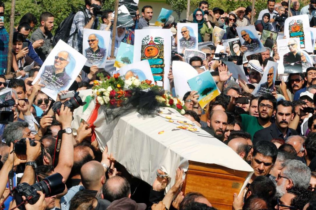 Mourners carry the coffin of Abbas Kiarostami on July 10 in the Iranian capital ahead of his funeral in the town of Lavasan. Photo: AFP