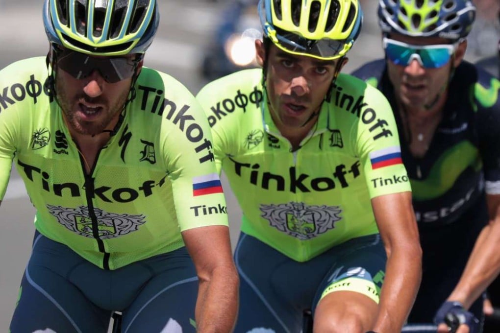 Spain’s Alberto Contador (centre) struggles as he rides with the pack during the 184.5 km ninth stage. Photo: AFP