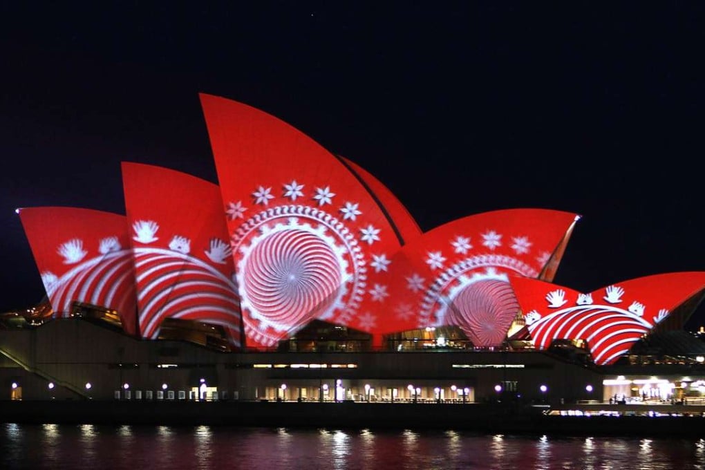 The sails of the Sydney Opera House turn red during a World Aids Day reception in 2011. Photo: Reuters
