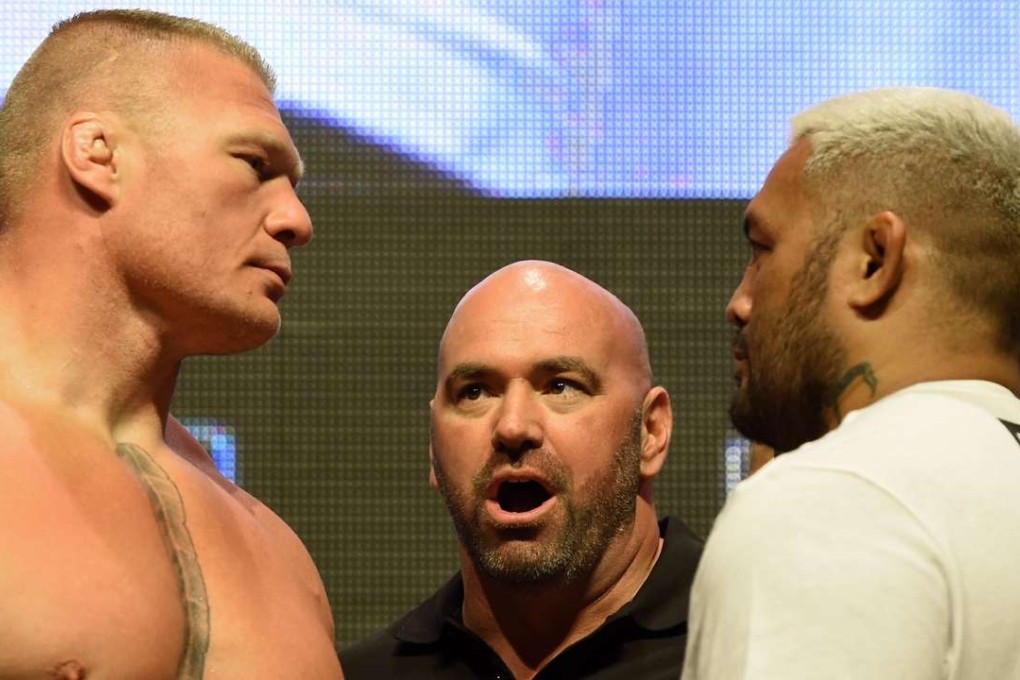 UFC President Dana White looks on as Brock Lesnar (left) and Mark Hunt face off ahead of UFC 200. Photo: AFP