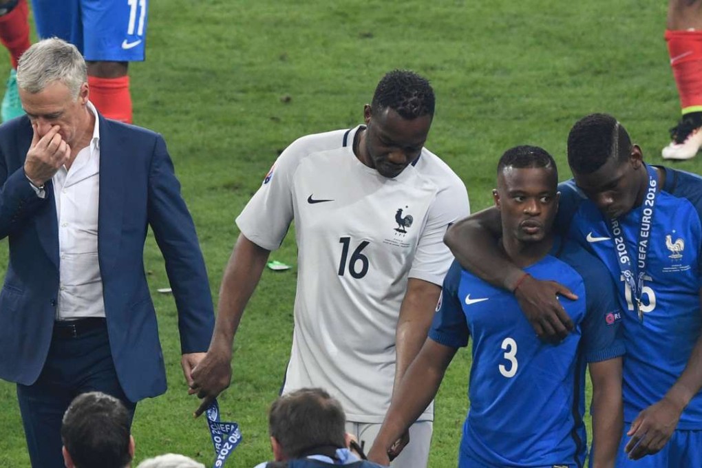 Didier Deschamps hangs his head after the final whistle. Photo: AFP