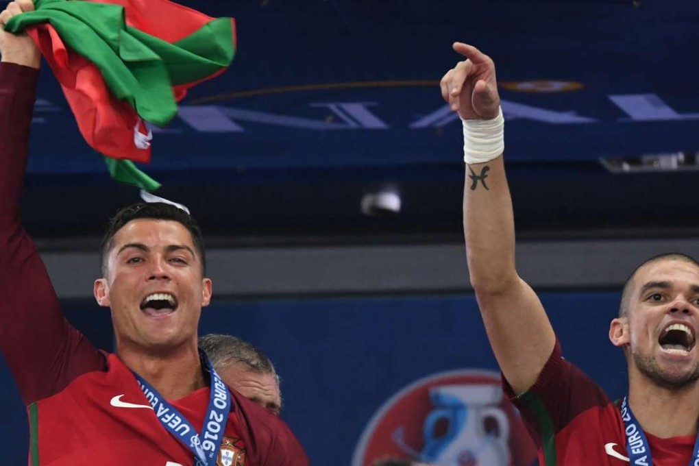 Cristiano Ronaldo and Pepe celebrate after beating France 1-0 in the Euro 2016 final in Paris. Photo: Xinhua