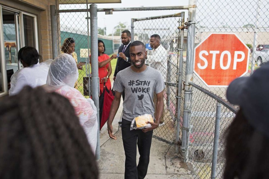 Black Lives Matter activist DeRay McKesson walks out of the Baton Rouge jail on Sunday. Photo: AP