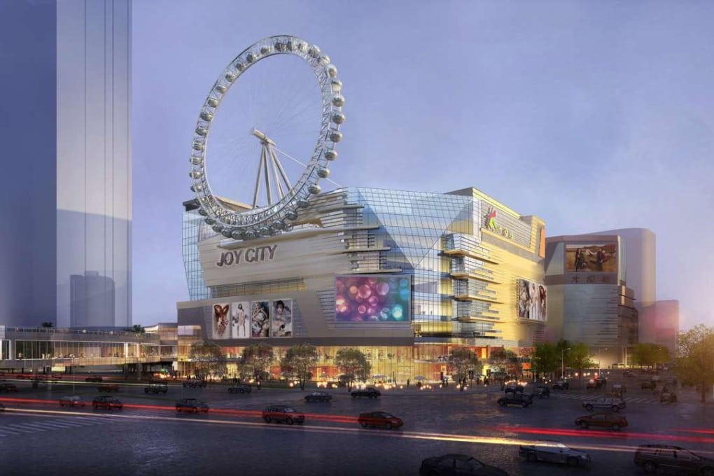 The rooftop shopping mall Ferris wheel, 98 meters above the ground, in Shanghai Joy City mall phase II, which opened in December last year. The 30 gondola are each equipped with an air conditioner, a bluetooth music player and a USB for charging smartphones. Photo: SCMP Handout