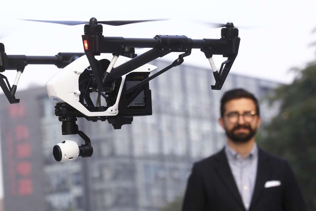 DJI PR Manager Michael Perry, driving remote control helicopter DJI Inspire 1 in Shenzhen. Photo: Dickson Lee