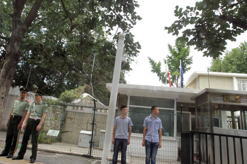 Police and plain-clothed officers stand in front of the Philippine Embassy in Beijing on Tuesday. Photo: Simon Song in front of the embassy. Police and armed police have enhanced the security surveillance around the Philippine Embassy in China in Beijing on Tuesday afternoon, Jul. 12, 2016, before the ruling on the South China Sea comes out. 12JUL16 Photo by Simon Song