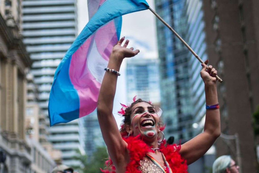 A reveller dances with joy during the annual Pride Festival parade in Toronto. Photo: AFP