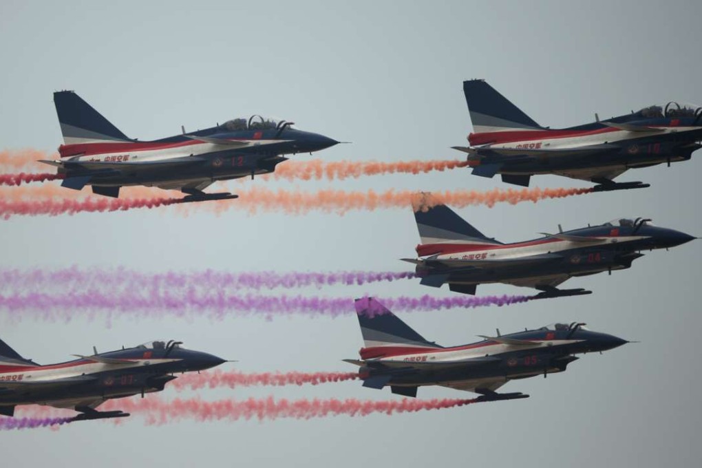 J-10 fighter jets of the Bayi Aerobatic Team of the People’s Liberation Army's Air Force perform at the Airshow China 2014. Photo: Johanne Eisele.