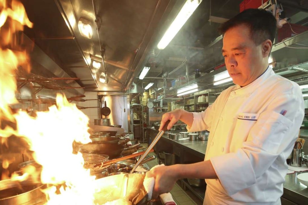 Ming Court's executive chef, Mango Tsang, cooking in the kitchen in Mong Kok. Photo: Edward Wong