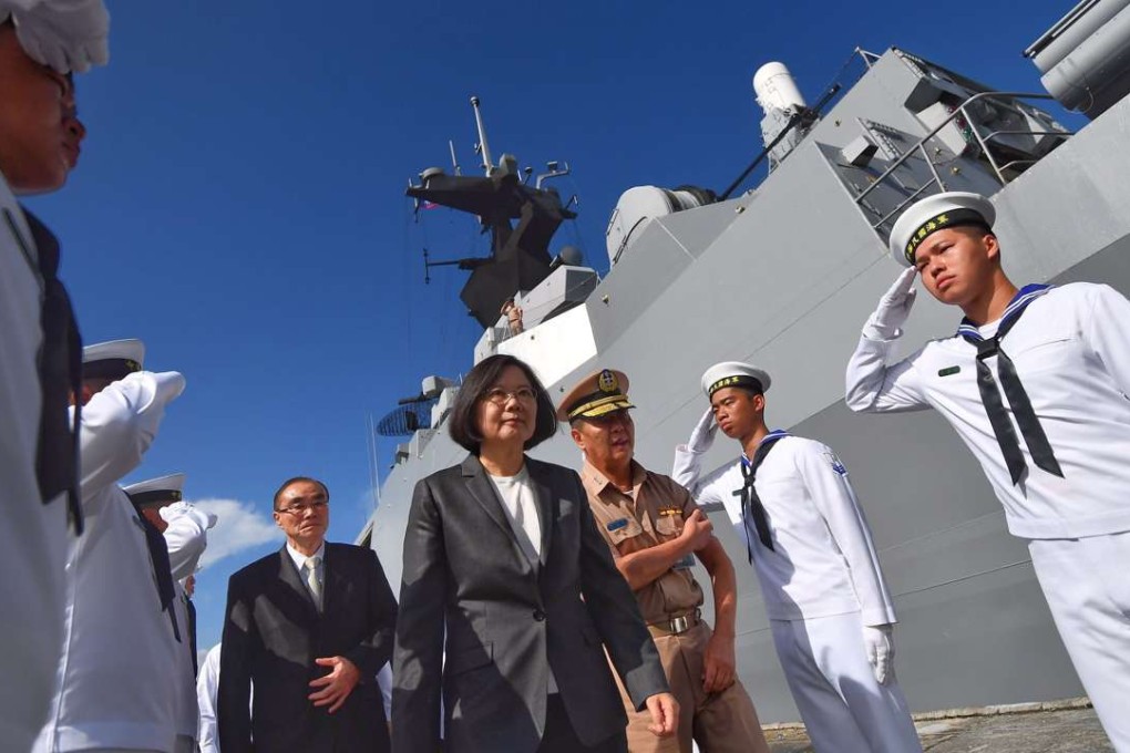 President Tsai Ing-wen walks aboard the frigate on Wednesday at a naval base in Kaohsiung. Photo: EPA