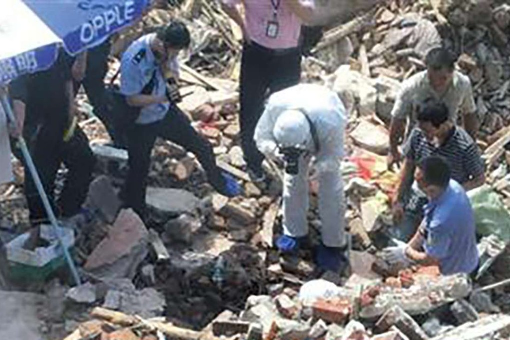 Police investigate the wreckage of a forcibly demolished house in Changsha where a body was found. Photo: SCMP Pictures