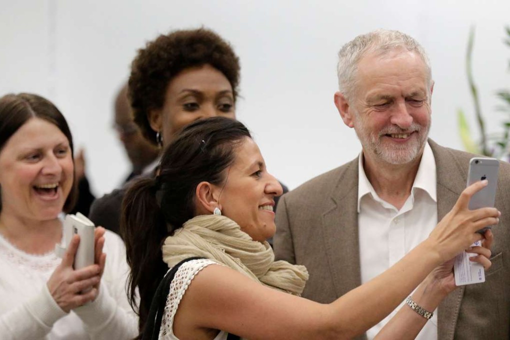 Britain's Labour Party leader Jeremy Corbyn stops to have his picture taken with supporters after a meeting of the National Executive Committee in central London on Tuesday. Photo: Reuters
