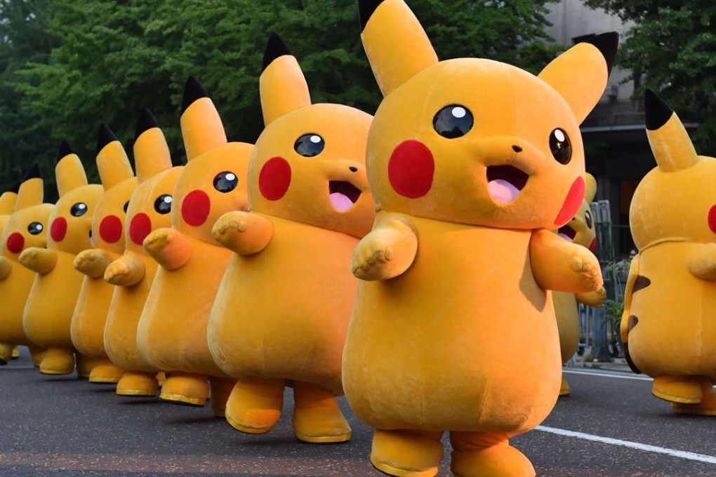 Costumed performers dressed as Pikachu, the popular animation Pokemon series character. Photo: AFP