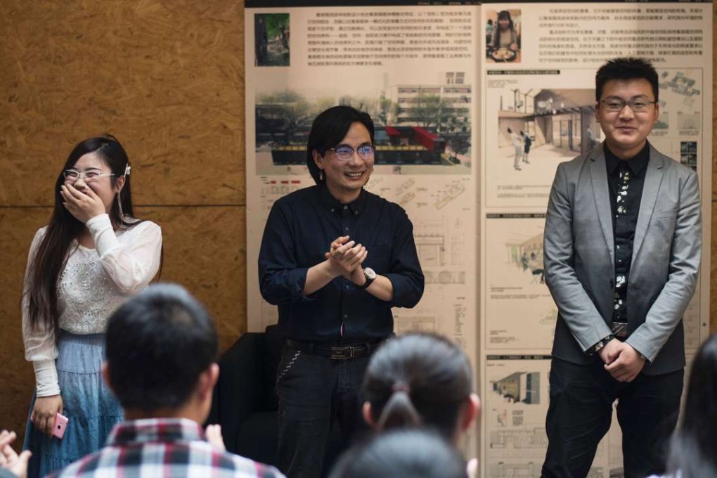 Xie Shu (centre) gives students a lesson on how to pick up the opposite sex. Photo: AFP