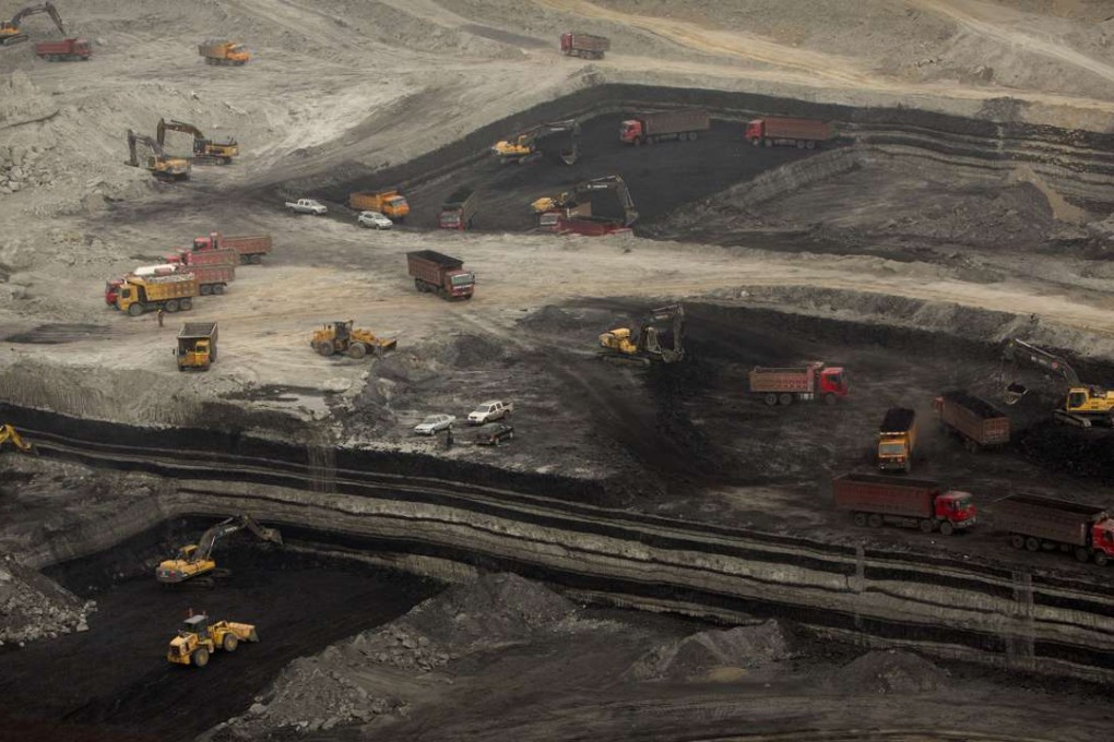 An open-cut coal mine near Ordos in Inner Mongolia Autonomous Region. New approvals have surged despite the introduction of policies cutovercapacity and chronic air pollution. Photo: AP