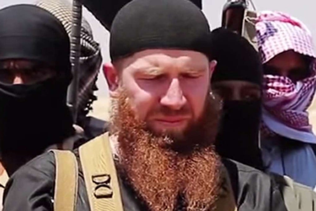 Abu Omar al-Shishani (centre) is shownat an unknown location between the Iraqi Nineveh province and the Syrian town of Al-Hasakah in 2014. Photo: AFP