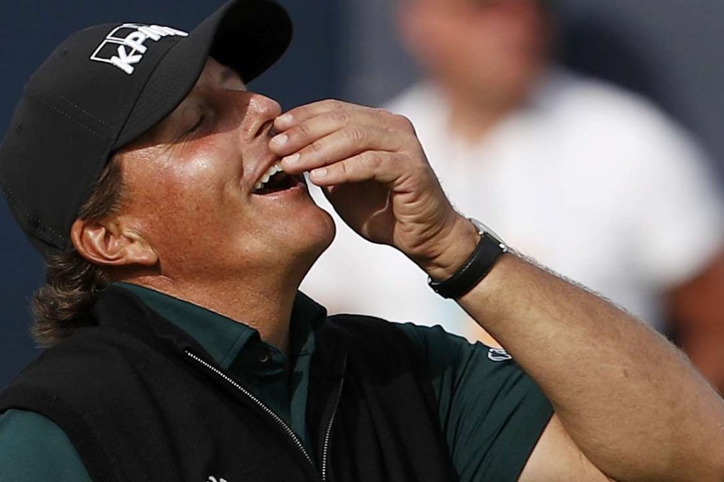 Phil Mickelson reacts after missing a birdie putt on the 18th green that would have broken a majors scoring record. Photo: Reuters