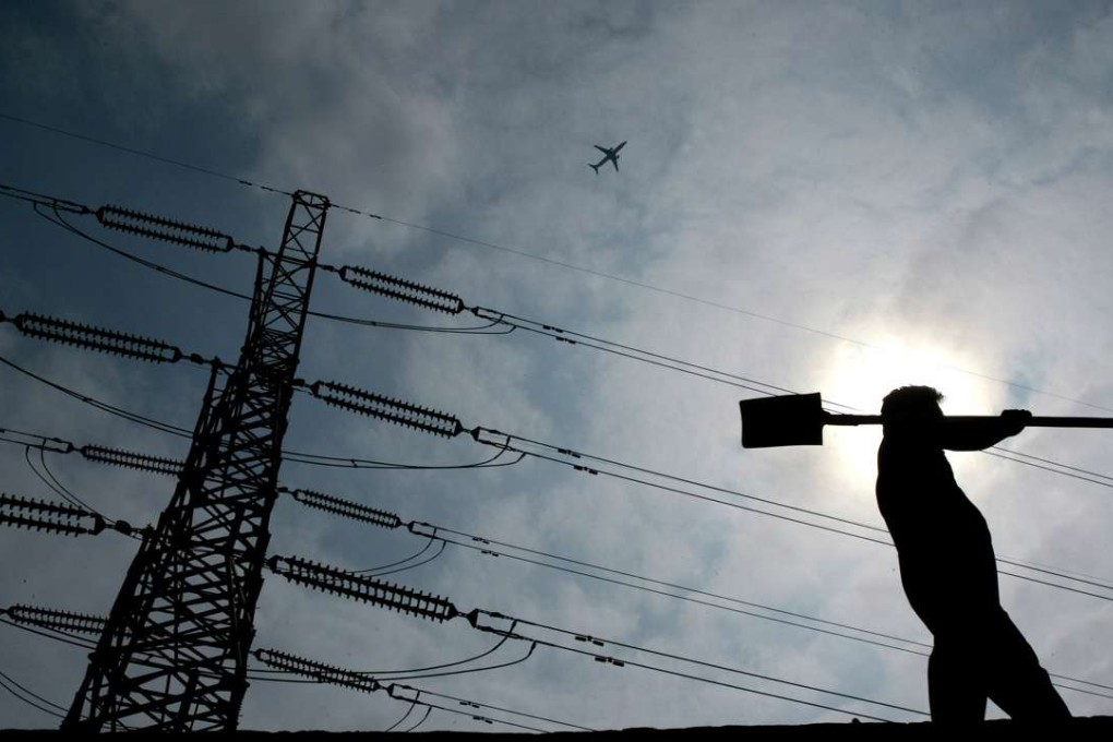 Power lines in Shanghai. China’s largest power producer says its generation in the country dropped 8.6pc in the first half. Photo: Reuters
