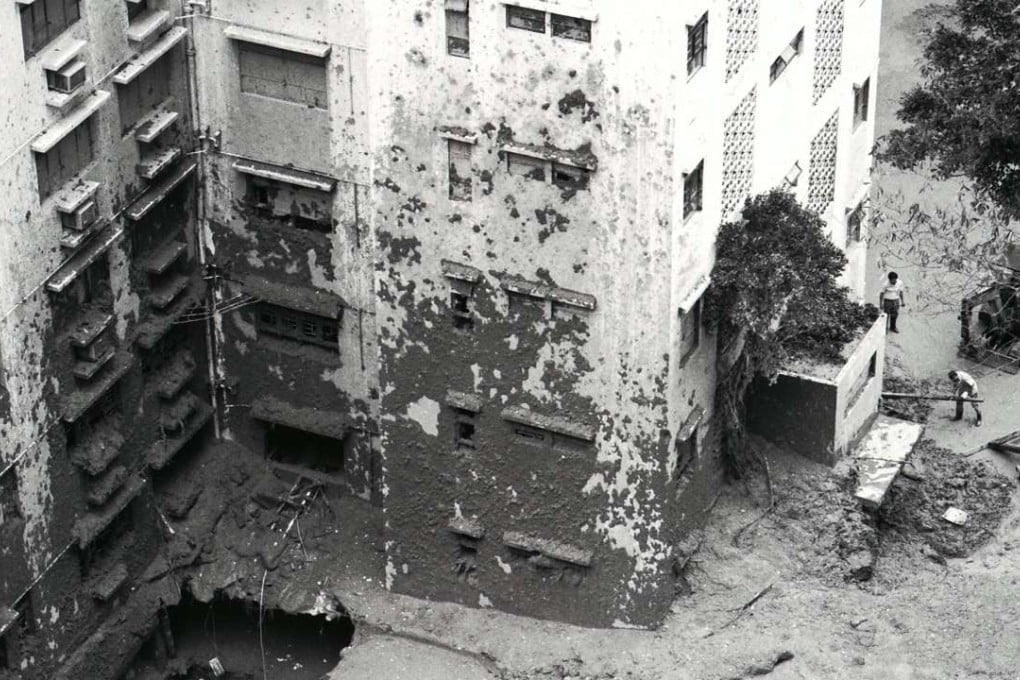 Workmen clear debris washed downhill in a fatal mudslide at Baguio Villa. Four deaths were reported at the luxury apartment complex in Mid-Levels after a 1992 deluge.