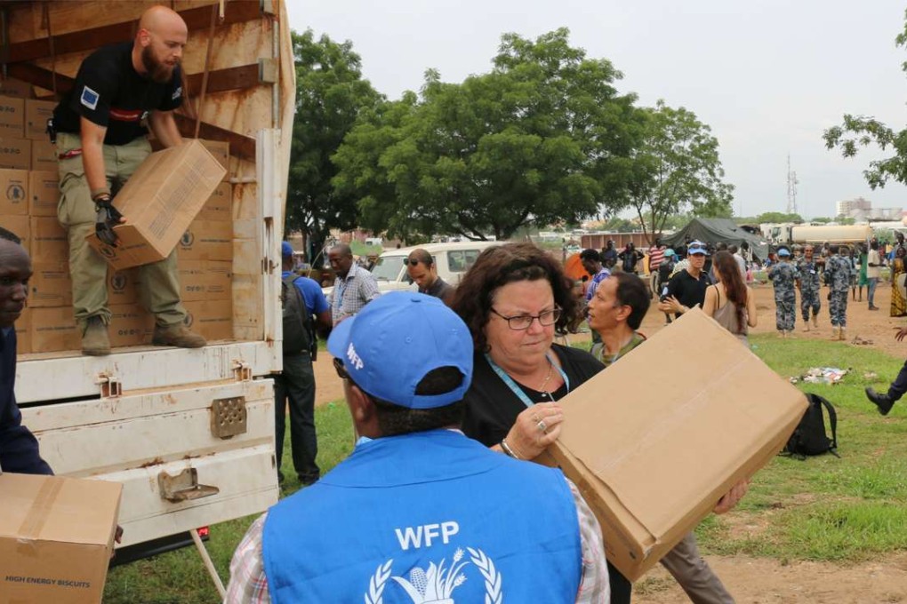 World Food Programme (WFP) staff prepare high-energy biscuits for distribution at the United Nations Mission in South Sudan (UNMISS) compound in Tomping. Photo: Reuters