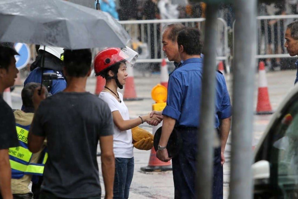 Ng On-yee (in helmet) at a June 28 ceremony for her late husband Samuel Hui Chi-kit, in Ngau Tau Kok. Photo: Sam Tsang