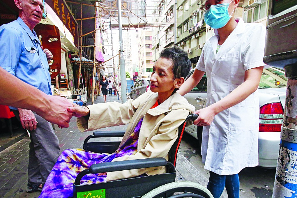 Christine Aquino begins her journey home to the Philippines. “There’s a feeling that there’s something missing in my life and I missed my family,” she said. Photo: Felix Wong