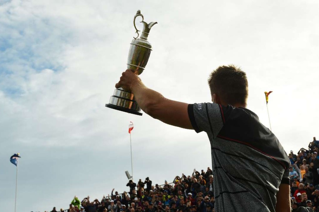 Sweden's Henrik Stenson shows off the Claret Jug. AFP