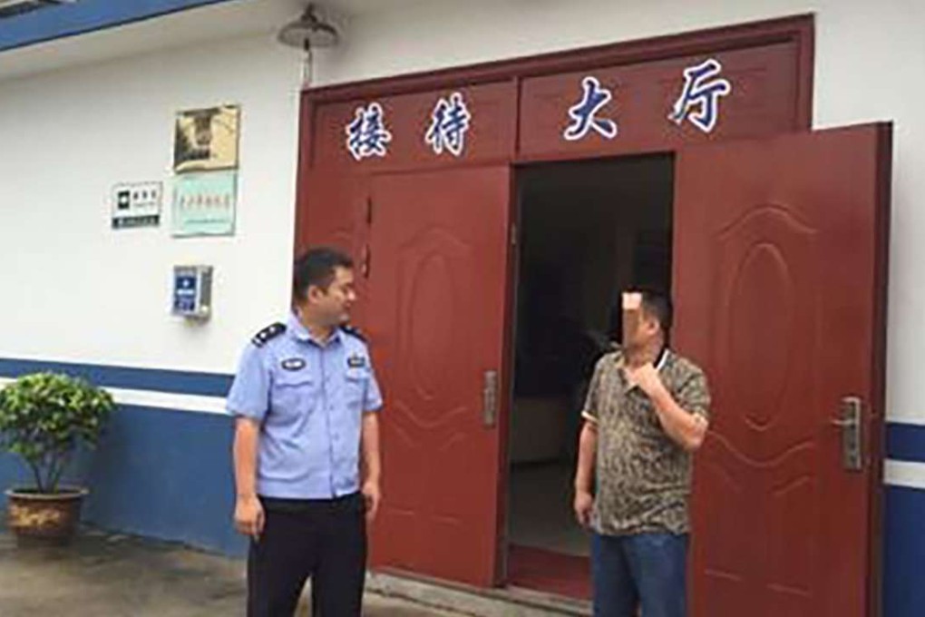 The former fugitive pictured after giving himself up to the police. Photo: Mytaizhou.net