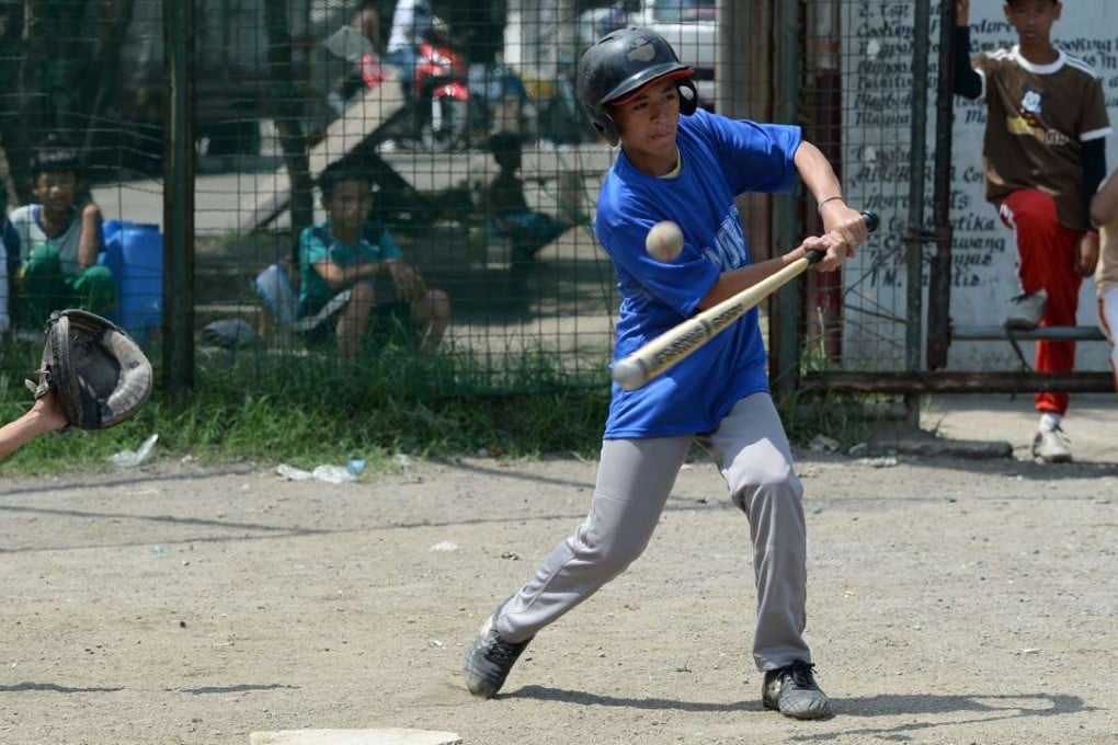 Teenager Piolo Perez of the Smokey Mountain baseball team. Photo: AFP