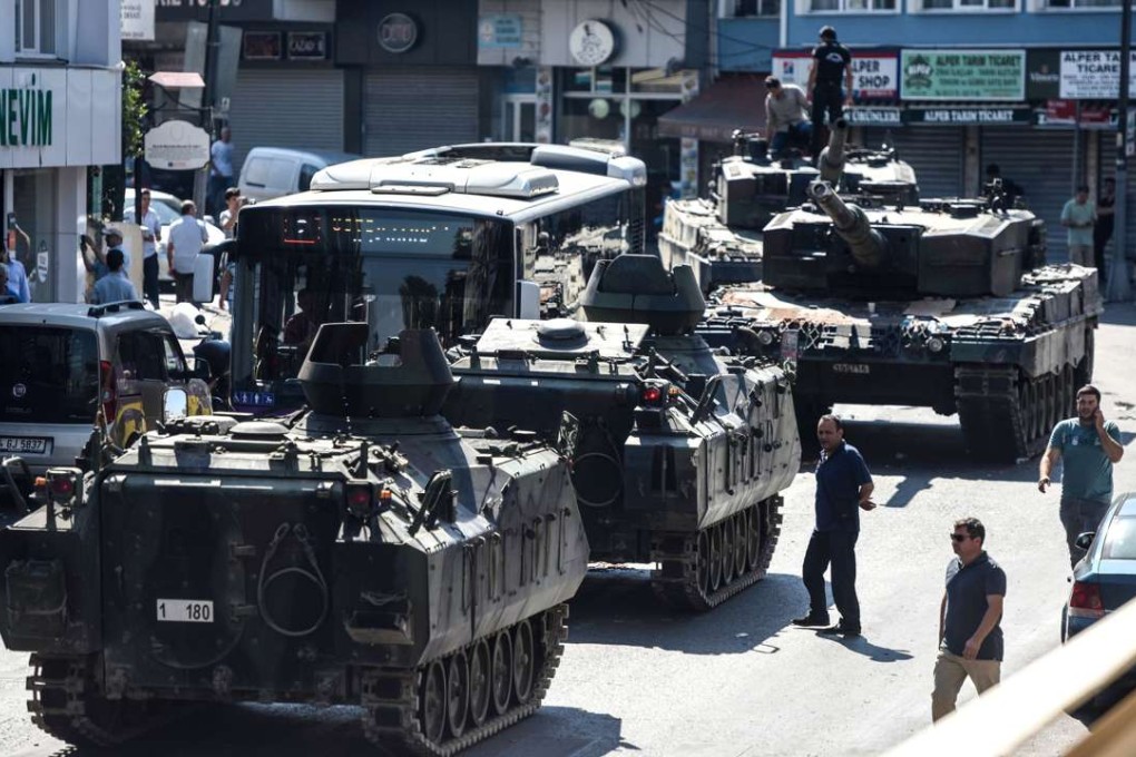 Abandoned tanks in the street after police took over the military position at the Anatolian side at Uskudar in Istanbul. Photo: AFP