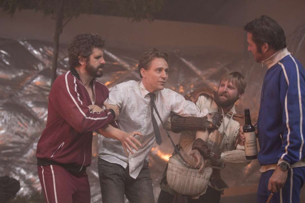 Tom Hiddleston (centre) in a still from High-Rise.