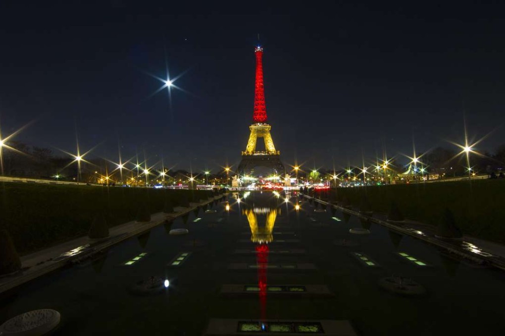 The Eiffel Tower is lit up in the national colours of Belgium as France mourns Belgian victims of terrorist attacks. There’s never been this kind of sympathy for Iraq. Photo: EPA