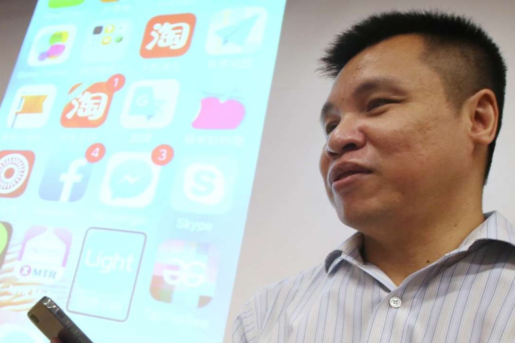 Edward Yip explains his project to collect 1,000 used iPhones for the visually impaired. Photo: David Wong