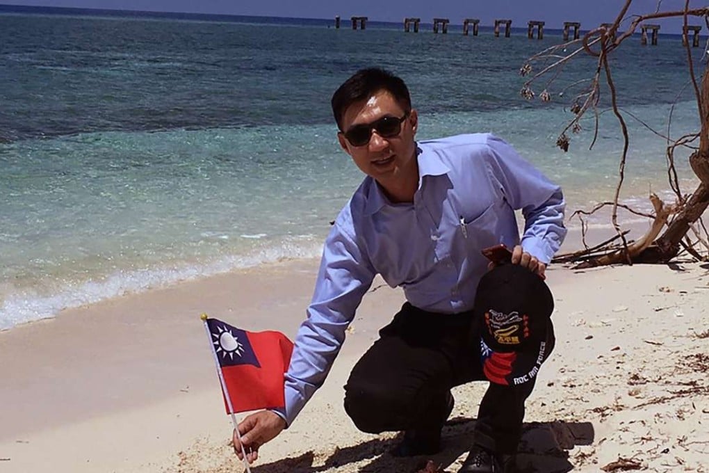 Taiwanese lawmaker Johnny Chiang holding a Taiwanese flag during a visit to Taiping island in the South China Sea. Photo: AFP / The Office of Kuomintang (KMT) lawmaker Johnny Chiang
