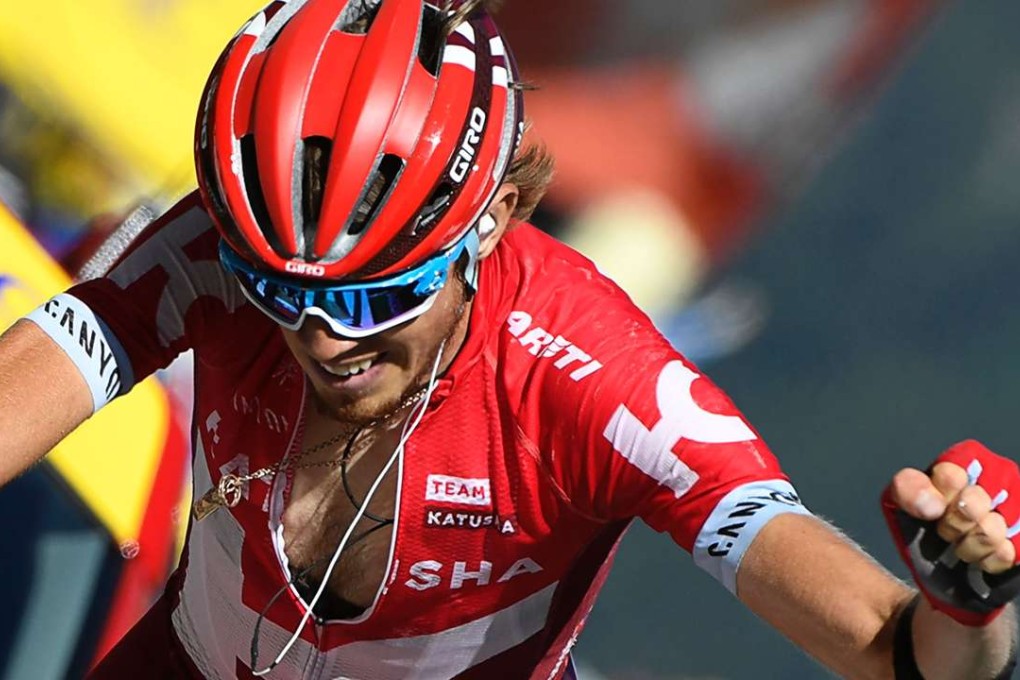Russia's Ilnur Zakarin celebrates as he crosses the finish line. AFP