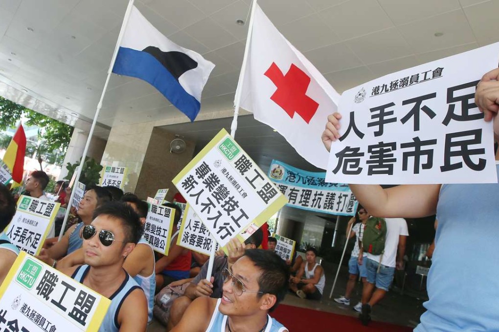 Lifeguards protesting for a better deal outside the headquarters of the Leisure and Cultural Services Department. Photo: David Wong