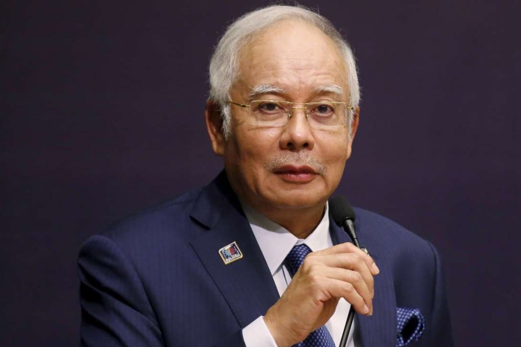 Malaysia's Prime Minister Najib Razak speaks at the opening of a conference as the US launches civil suits to recover over US$1 billion from scandal-plagued 1MDB. Photo: Reuters