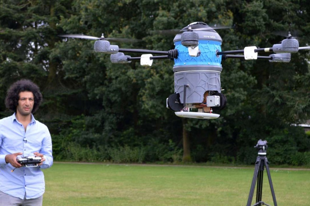 Afghan refugee Massoud Hassani flying an anti-landmine drone. Photo: AFP