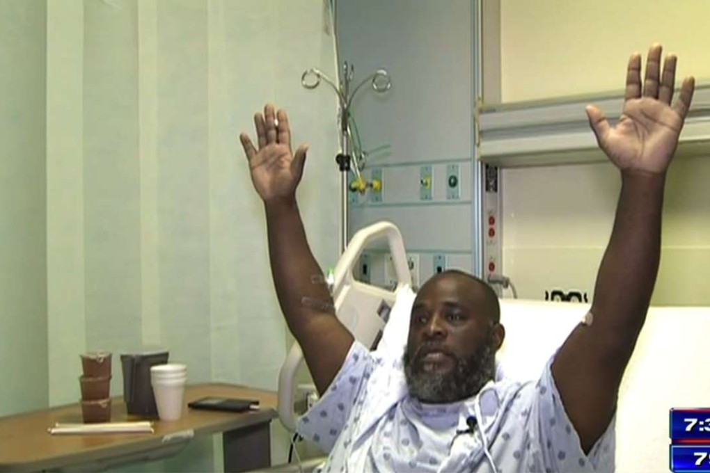 In this frame from video, Charles Kinsey explains in an interview from his hospital bed in Miami on Wednesday what happened when he was shot by police on Monday.Photo: WSVN via AP